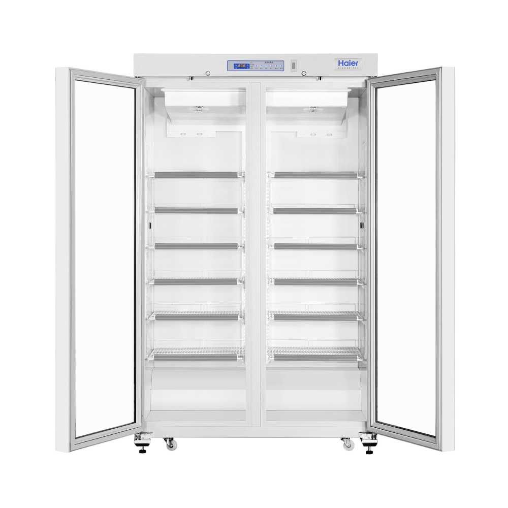 Open Haier HYC-1031GD Pharmacy Refrigerator revealing spacious interior with adjustable shelves and cooling units.