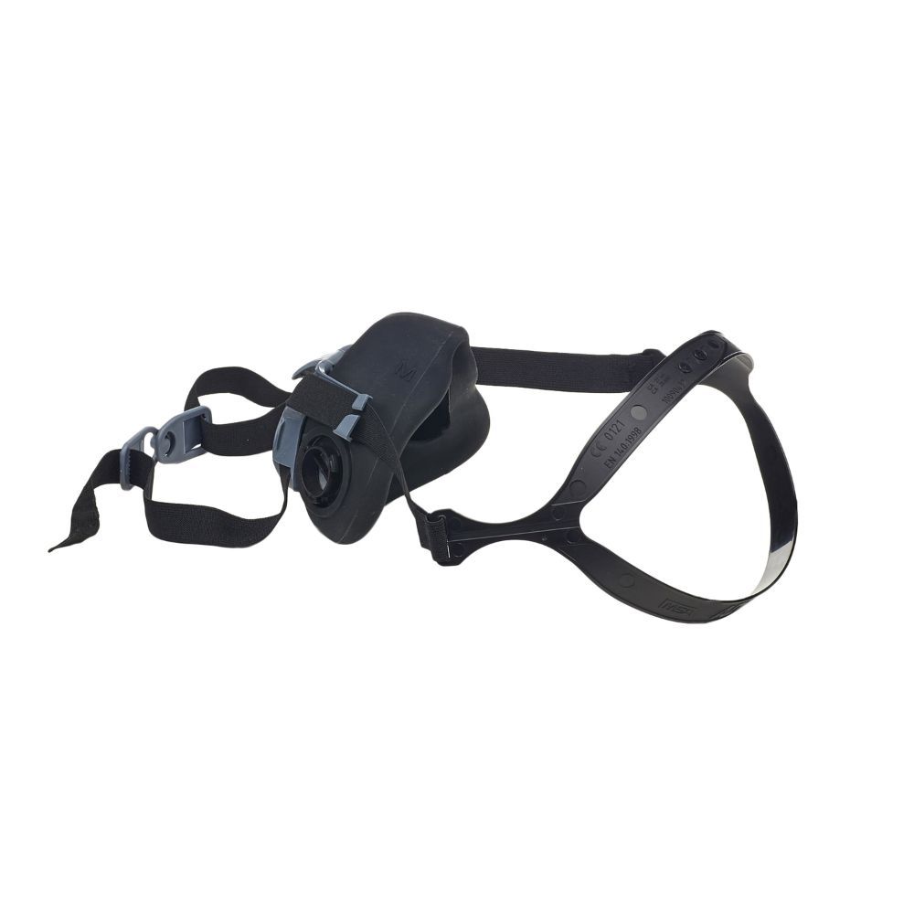 Side view of MSA Advantage 420 half-mask respirator in black, showing cartridge port, ergonomic facepiece, and adjustable head harness with quick-release buckle.