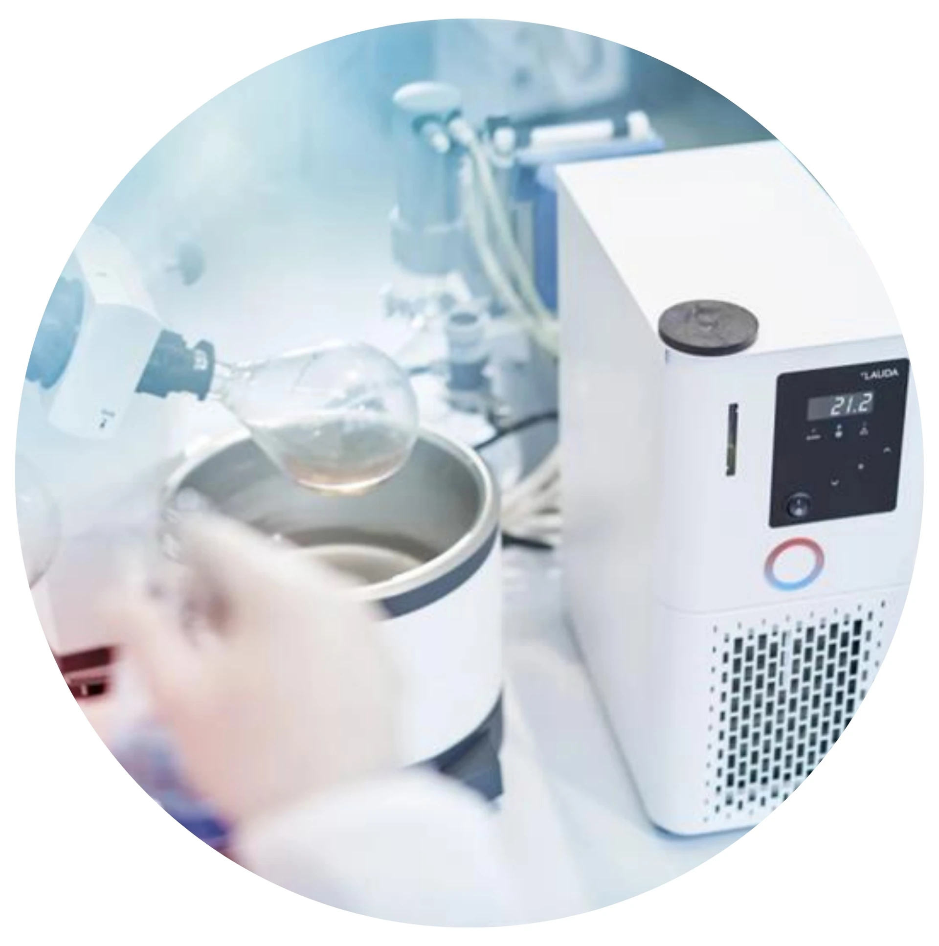 Rotary evaporator system in use with a condenser flask and digital chiller, commonly used for solvent removal in laboratory settings.